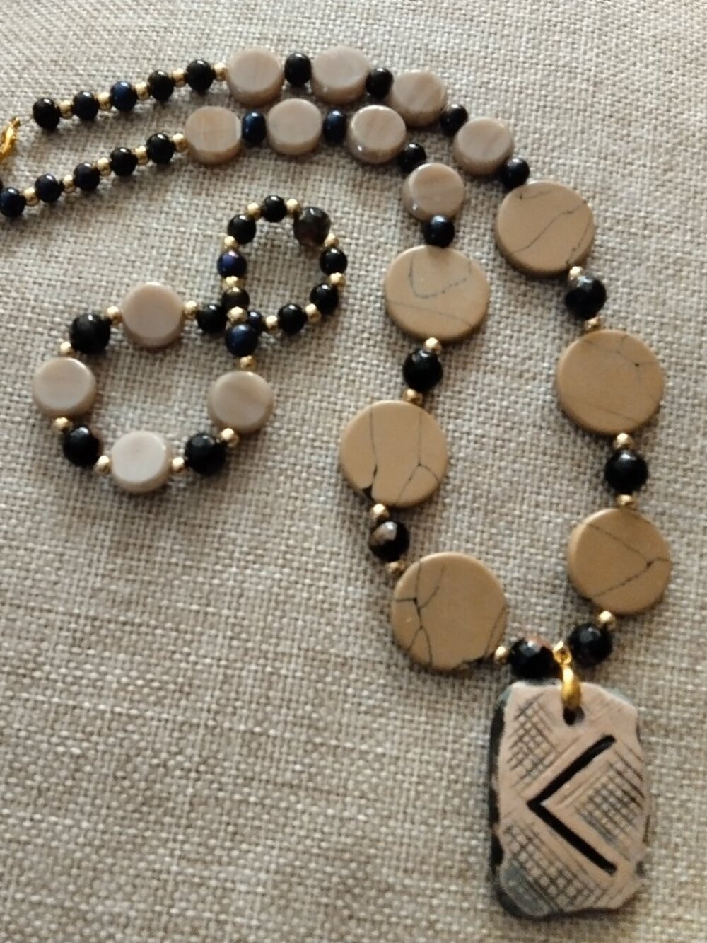 Sandy jadeite necklace and stretch bracelet .